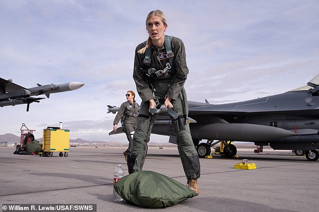 Swamp.  pictured preparing for her introductory flight, believes she is the first active-duty officer from any military branch to represent the Miss America organization at the national level