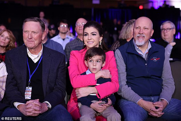 Roy (right) sits next to Florida First Lady Casey DeSantis;  son Mason, five;  and Iowa evangelical leader Bob Vander Plaats (left) during DeSantis' Fox News town hall in West Des Moines, Iowa on Tuesday evening