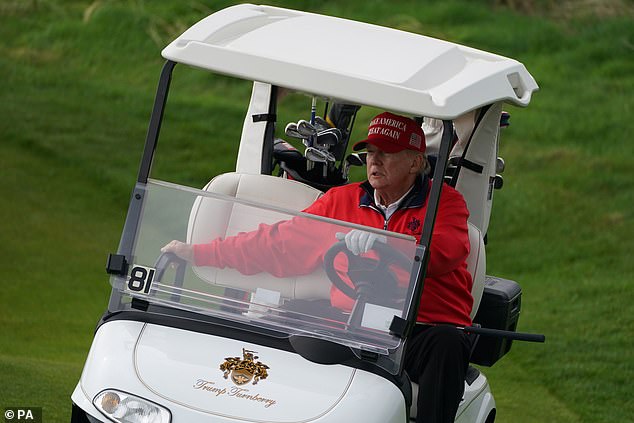 Former US President Donald Trump plays golf at his Trump Turnberry course in May 2023