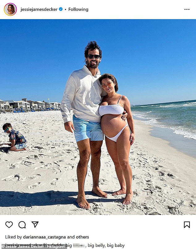 Jessie also showed off her bump as she lounged on the beach with Eric in a white bikini