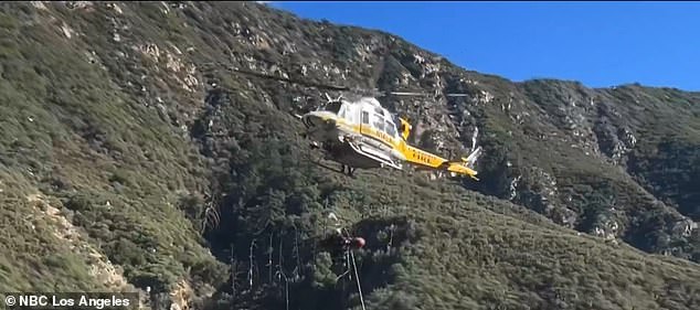 The woman is seen being transported from the Angeles National Forest to a nearby hospital.  She is believed to have suffered a broken ankle and is in stable condition