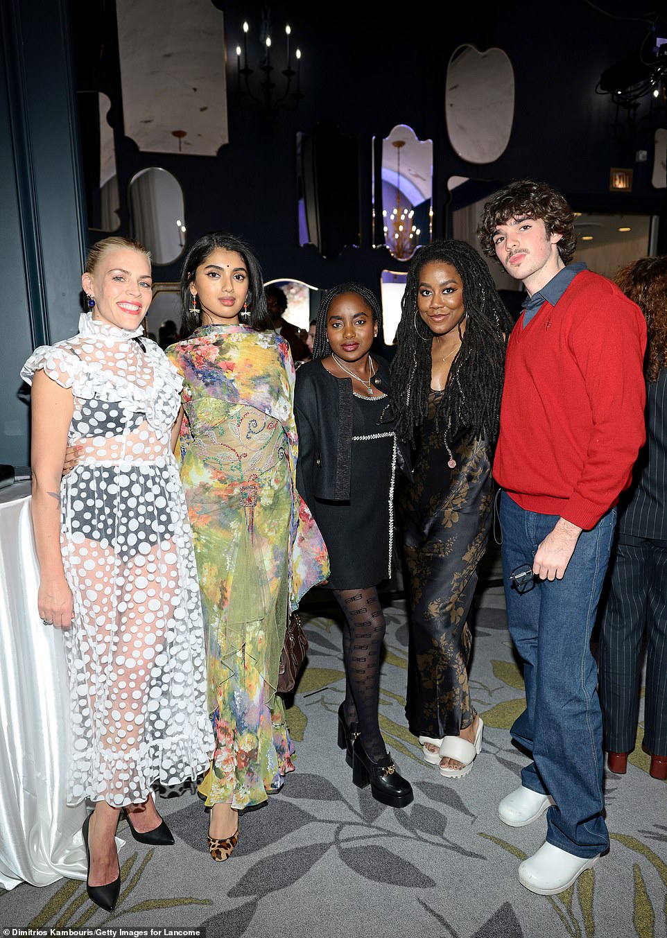 The Illinois-born blonde mingled with the likes of her Mean Girls co-star Avantika (2-L), author Tomi Adeyemi (2-R) and singer Silas Silverman (R)