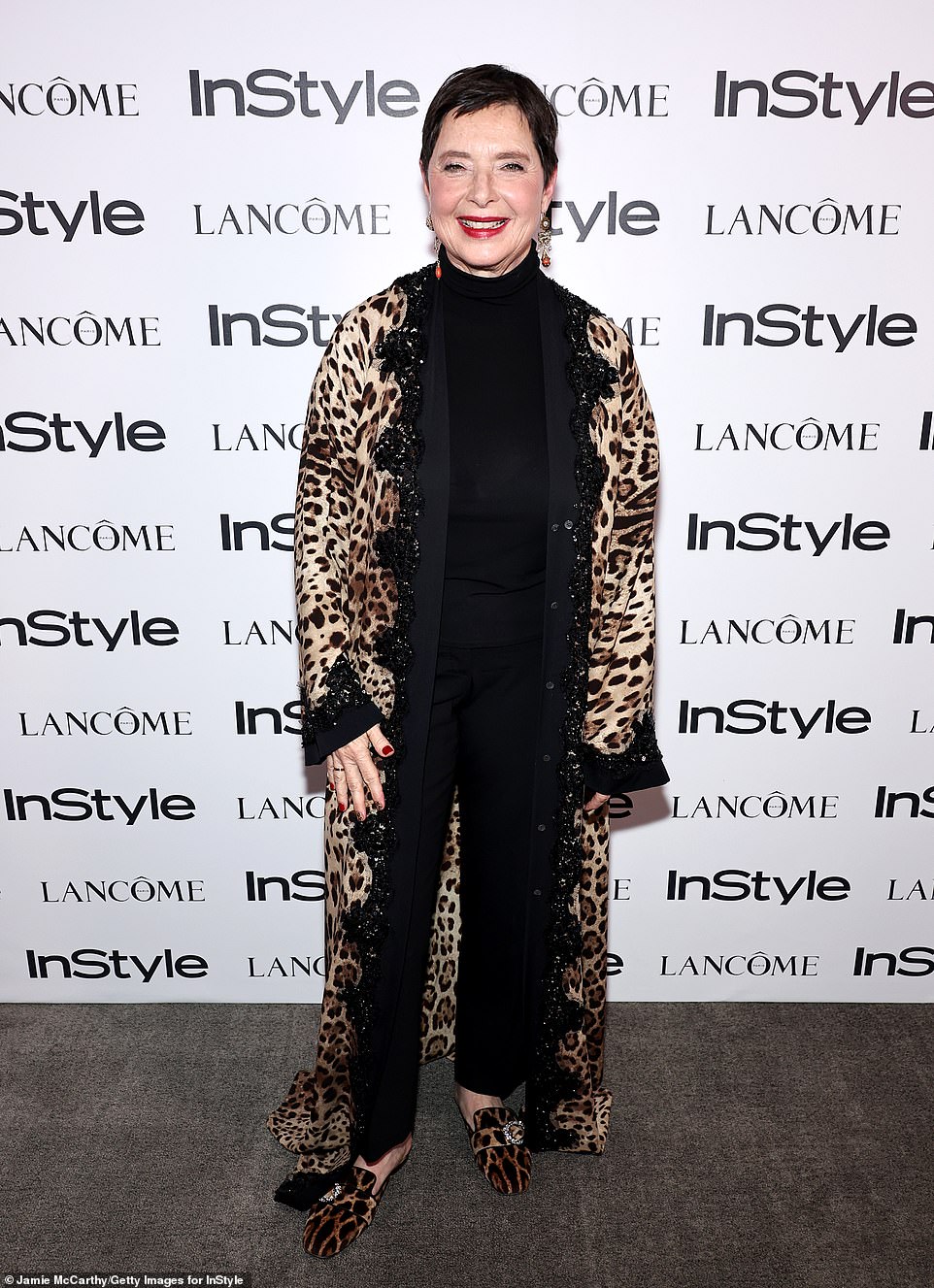 The 71-year-old daughter of Ingrid Bergman - who is loved by David Lynch and Martin Scorsese - wore a leopard print maxi coat and slippers with a black top and trousers