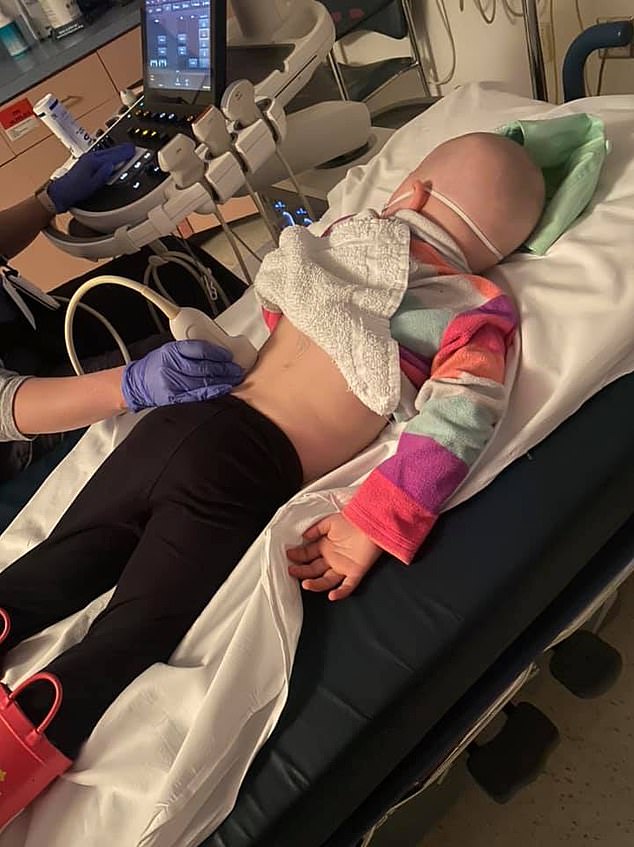 Addey is seen in April lying on a hospital bed while having an ultrasound scan of her back.  The mother created a public Facebook page called “Ours” "Rae" Or Sunshine Team Addey Rae, where she posted sad images of her daughter