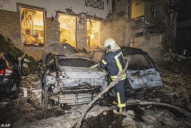 Firefighters are working to extinguish a fire after a Russian missile attack that hit a hotel in Kharkiv, Ukraine late Wednesday