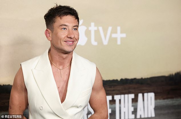 He hit the red carpet in a sleeveless white double-breasted top, which showed off the former amateur boxer's toned physique