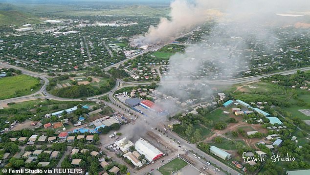 An aerial view of smoke rising from burning buildings, amid looting and arson during protests over a pay cut for police that officials blamed on an administrative glitch, in Port Moresby