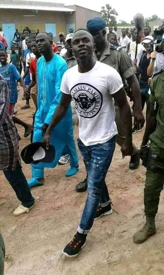 Sadio Mane visits his childhood village Bambali in Senegal.  The couple are both originally from the Casmance region