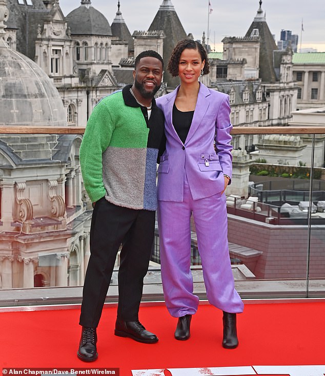 Donning a striking lilac power suit, Gugu looked effortlessly sophisticated in the two-piece, tucking her slightly baggy trousers into black leather boots