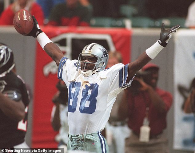 Michael Irvin is pictured celebrating a touchdown against the Falcons on October 29, 1995