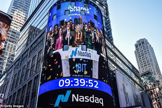 The Nasdaq sign in Times Square shows scenes of the opening bell ringing as bitcoin spot ETFs launch on the Nasdaq on January 11.