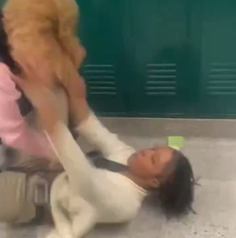 The teacher seemed to gain the upper hand for a moment as she struggled with the angry teen