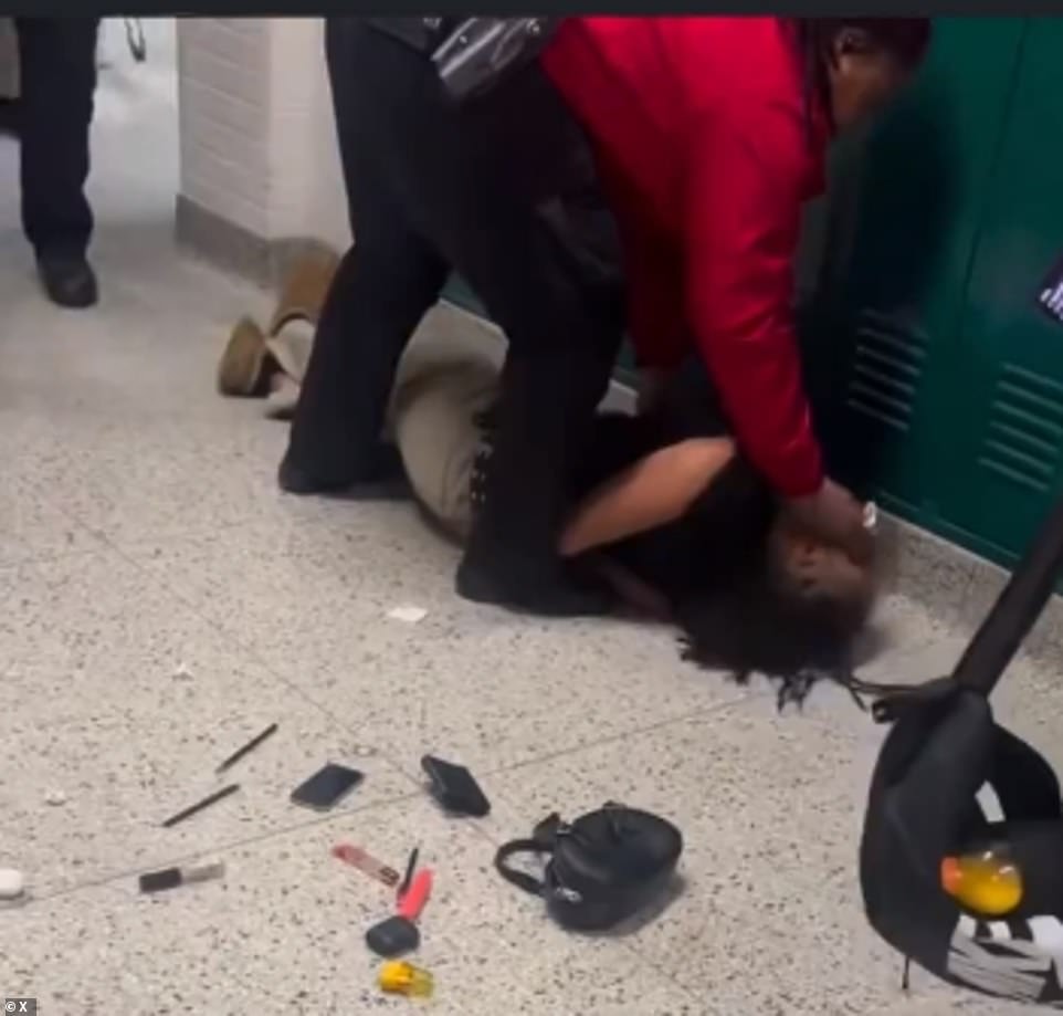 Seconds later, a security guard tries to save the student's life as she lies handcuffed and convulsing on the ground