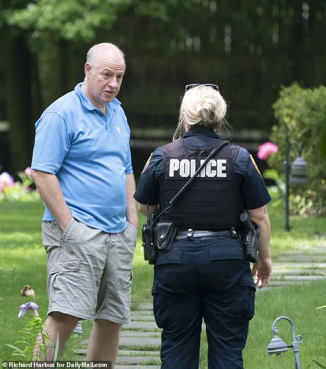 Dr.  Peter Daszak (left) is accused of bullying other scientists into writing off the lab leak theory despite emerging evidence.  In the photo: Dr.  Daszak speaks to police when approached by a reporter from DailyMail.com at his home in Suffern, New York