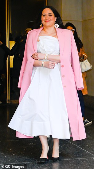 The actress arrived at the New York City studio in a vibrant yellow and white coat with blue accents, before changing into a white and pink look