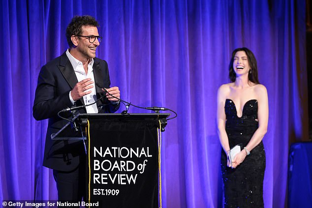 Cooper was flanked by Anne Hathaway as he delivered his acceptance speech