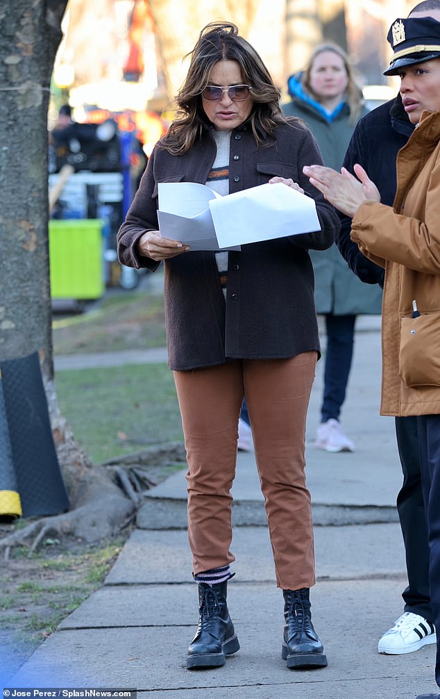 The actress completed her look with matching black pants and black boots for her day on set.