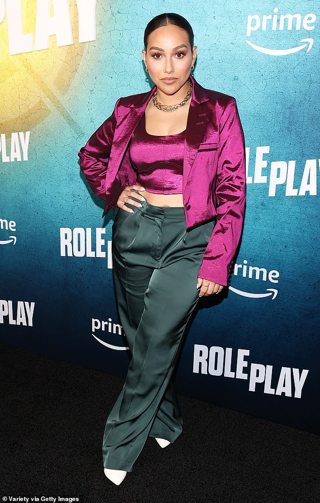 Actress Danielle Larracuente arrived in a royal purple and forest green color block