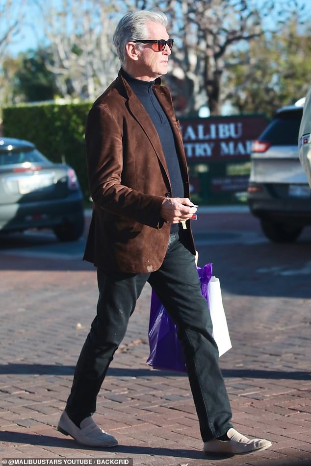 The actor, 70, looked dapper in black trousers and a dark zip-up sweater, which he paired with a brown blazer and beige loafers