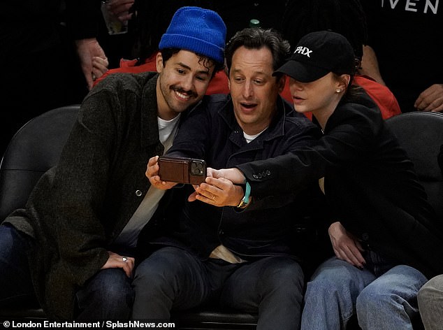 Emma and Ramy took a selfie with a mutual friend holding a phonescape as Emma pressed capture.