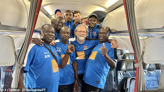 Saintfiet, center, and his Gambian team boarded a replacement flight on Thursday afternoon