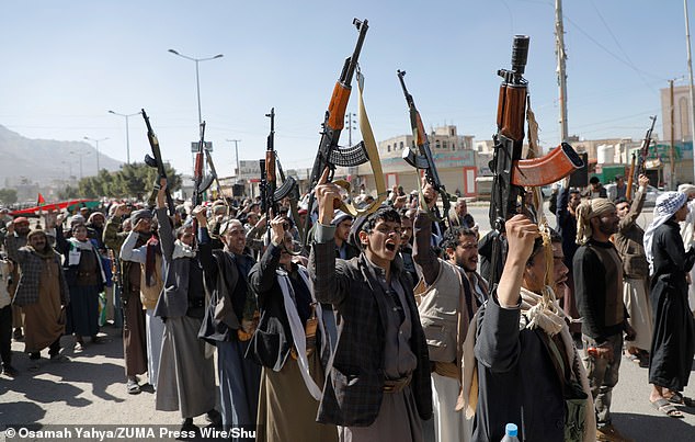 Huthi fighters brandish their weapons during a march in solidarity with the Palestinian people in the Huthi-controlled capital Sanaa on January 11