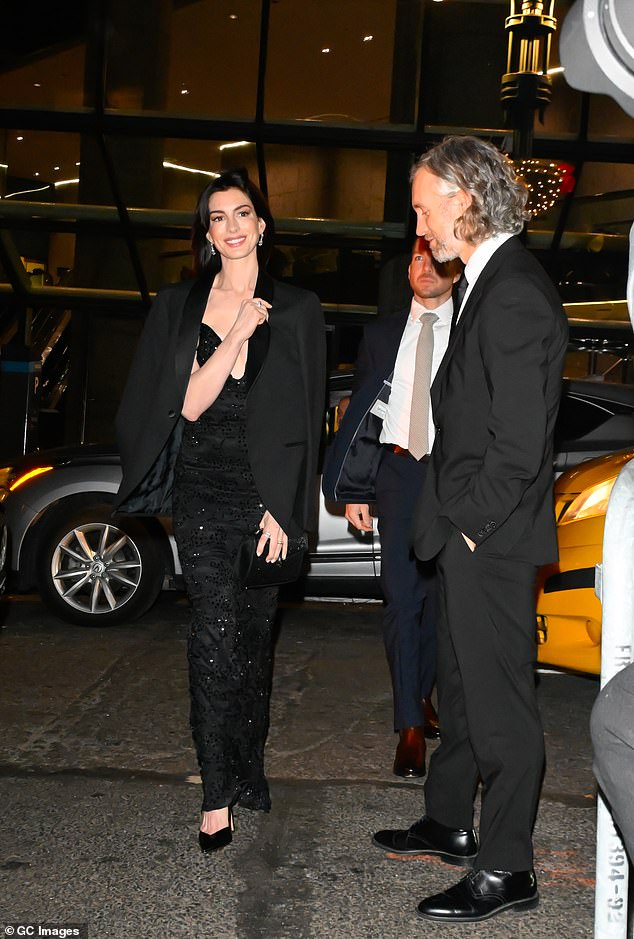 Shulman wore a classic black suit with a satin tie and shiny dress shoes to match Hathaway's look.  The Devil Wears Prada alumna has been married to the jewelry designer since 2012 and has two children together