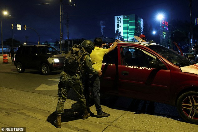 A soldier searches a man at a checkpoint, amid the ongoing wave of violence across the country, in Guayaquil, Ecuador, January 11, 2024