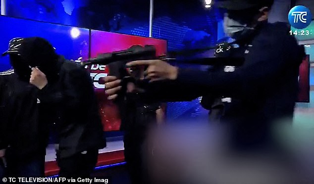 Video recording of live footage from Ecuadorian TC television, showing armed men wearing balaclavas storming the studio of the public television station TC