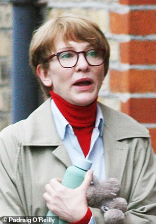 Cate looked worlds away from her glamorous look with the wig and glasses