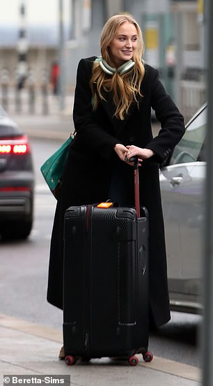 The 27-year-old actress, who is currently dating British aristocrat Peregrine Pearson, smiled as she carried her suitcase through the airport