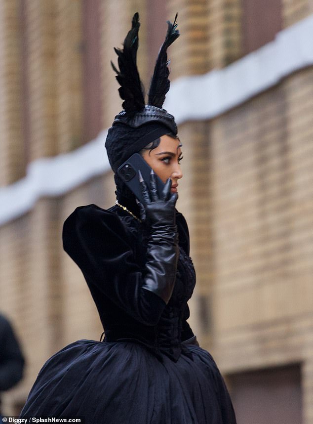 Fingerless wore leather opera gloves and revealed a creepy manicure with black nail polish