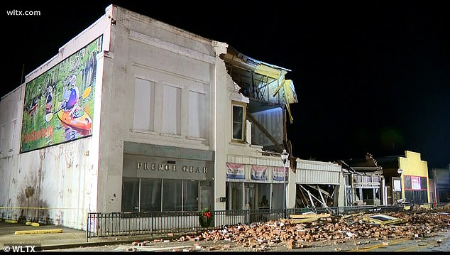 Stones are seen in the city center street after two buildings were significantly damaged