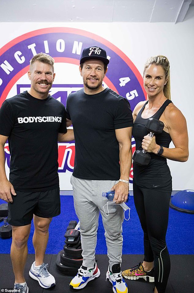 Hollywood actor Mark Wahlberg invests $450 million in F45.  He is pictured with David and Candace Warner