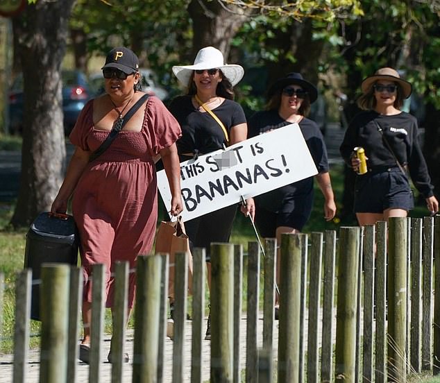 Anti-vax mandate protesters (above) swarmed to Jacinda Ardern's wedding venue ahead of her wedding to Clarke Gayford