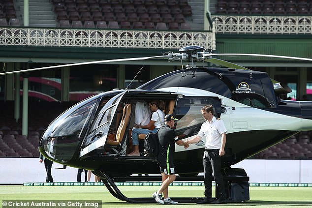 The couple later arrived at the SCG in rockstar fashion by chartered helicopter ahead of the Sydney derby at the Big Bash on Friday night.