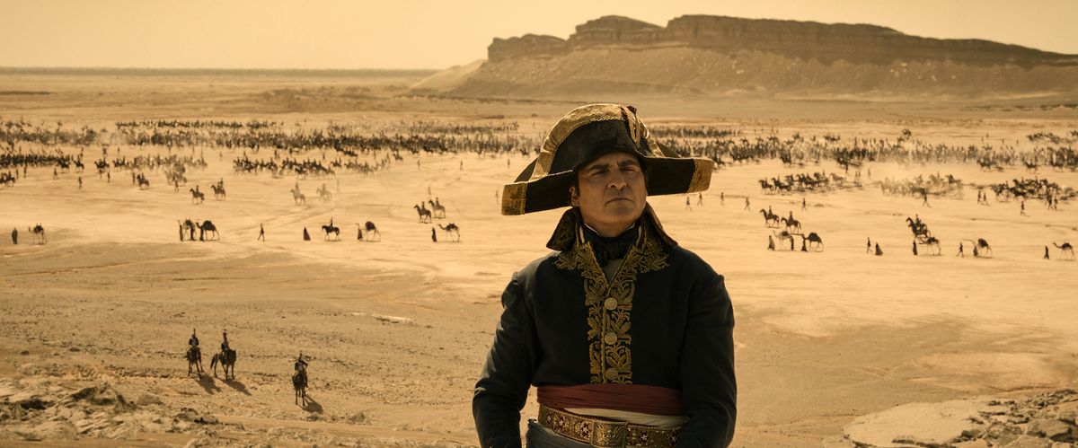 Napoleon stands proudly in front of a desert battlefield in the film Napoleon