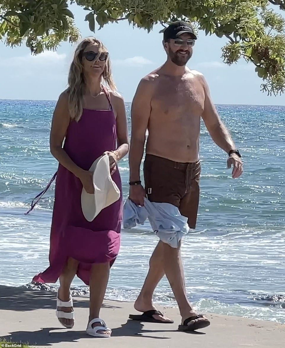 Baumgartner was pictured chatting with Connor during their beach walk last July.  The pair were photographed laughing together as they strolled on the beach, but Baumgartner denied a relationship with Connor under oath during her divorce proceedings.