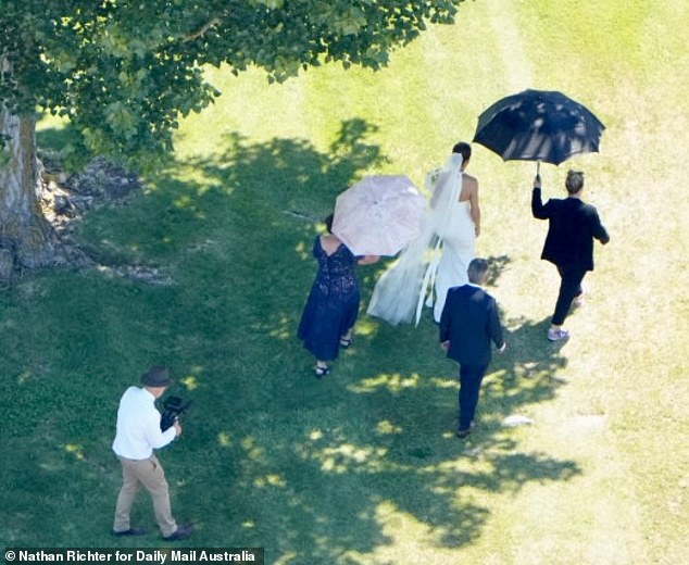 Ardern arrived from her neighboring accommodation by 4WD vehicle before walking through the vineyards shaded from the sun by an entourage of parasols