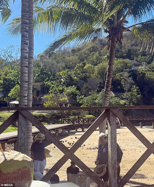 Bill Clinton is seen on the beach of the exclusive Mexican resort