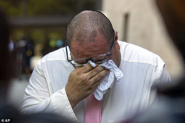 Paul Jamrowski, father of Jordan Anchondo and father-in-law of Andre Anchondo, both of whom were killed in the El Paso Walmart mass shooting, breaks down in tears while speaking to the media outside federal court in El Paso, Texas, Wednesday, July 5. Patrick Crusius will receiving multiple life sentences after pleading guilty to federal hate crimes in one of the deadliest mass shootings in U.S. history