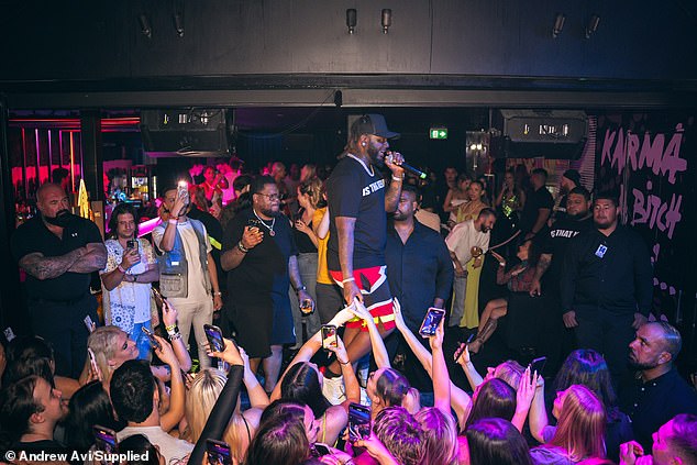 Faheem Rashad Najm, better known by his stage name T-Pain, opted for a black and white shirt and red, white and black shorts