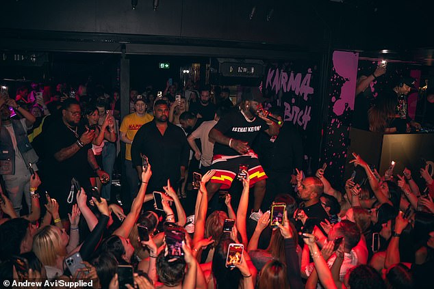 He completed his look with a black cap, sneakers and a chunky, bling-out chain around his neck