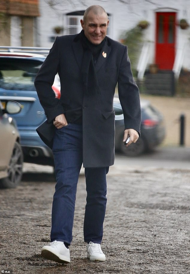 Vinnie completed his look with a black scarf and white trainers as he led the group out of the bitter cold and into The Merry Harriers pub.