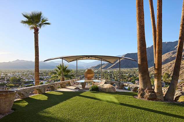 The house is located on an expansive 1.3-acre lot in a gated community in the California desert