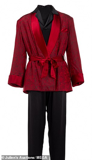 Among the items in the auction associated with the late Playboy founder Hugh Hefner is a full ensemble of a classic smoking jacket, silk pajamas, slippers and a pipe that Hefner wore.