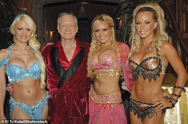 Hefner wore his traditional ensemble in 2005 alongside Holly Madison, Bridget Marquardt and Kendra Wilkinson