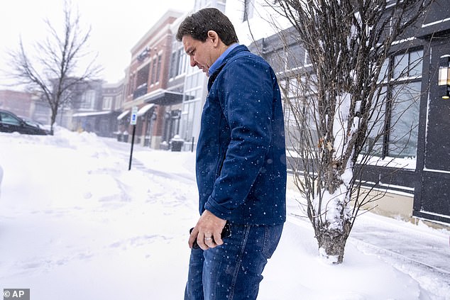 Ron DeSantis leaves after speaking at a Northside Conservatives Club Meeting at The District in Ankeny, Iowa on Friday, as Arctic temperatures hit the state