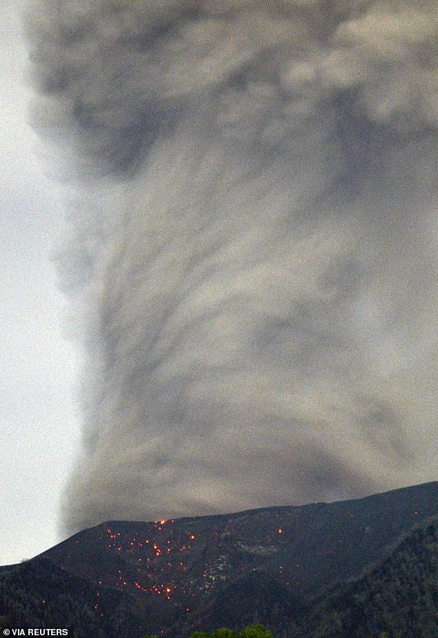 Mount Marapi volcano spews volcanic material during an eruption, seen from Nagari Bukik Batabuah in Agam, West Sumatra province, Indonesia, January 13, 2024