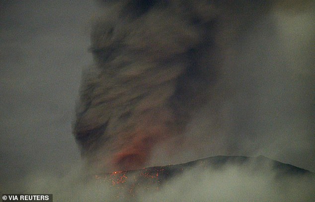 Mount Marapi volcano spews volcanic material during an eruption, seen from Nagari Bukik Batabuah in Agam, West Sumatra province, Indonesia, January 13, 2024